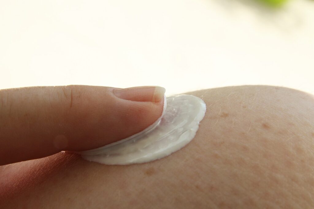 Close up image of lotion being applied to skin